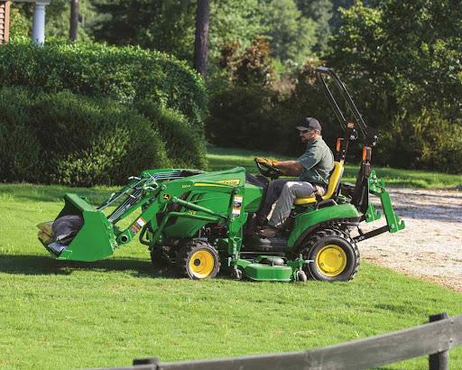 Joh Deere tractor mowing a lawn