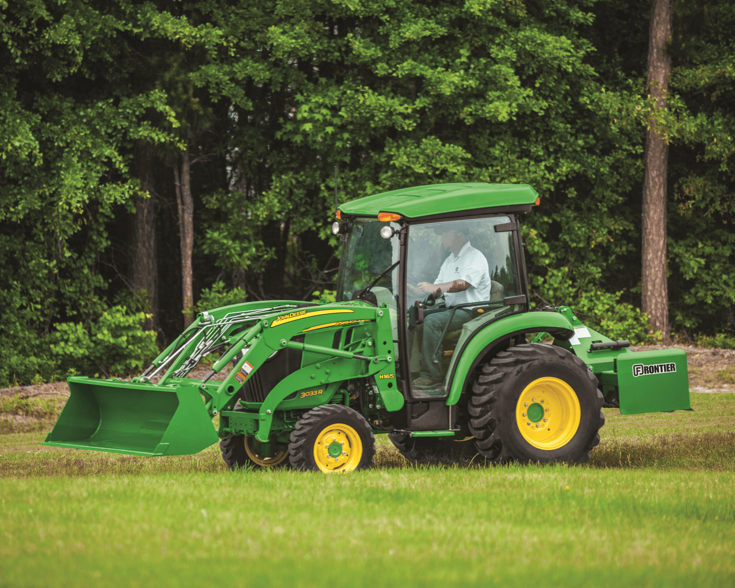 A John Deere 3033R tractor completes work on an urban farm in California.