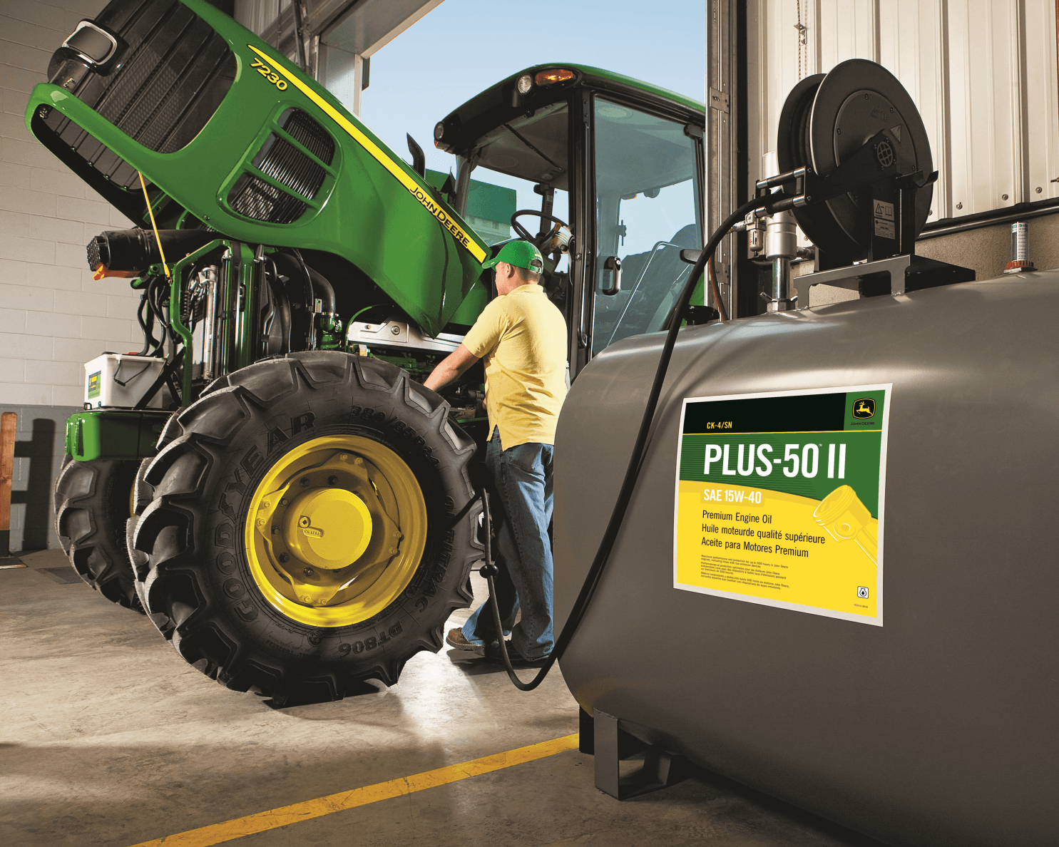 A John Deere tractor receives oil service.