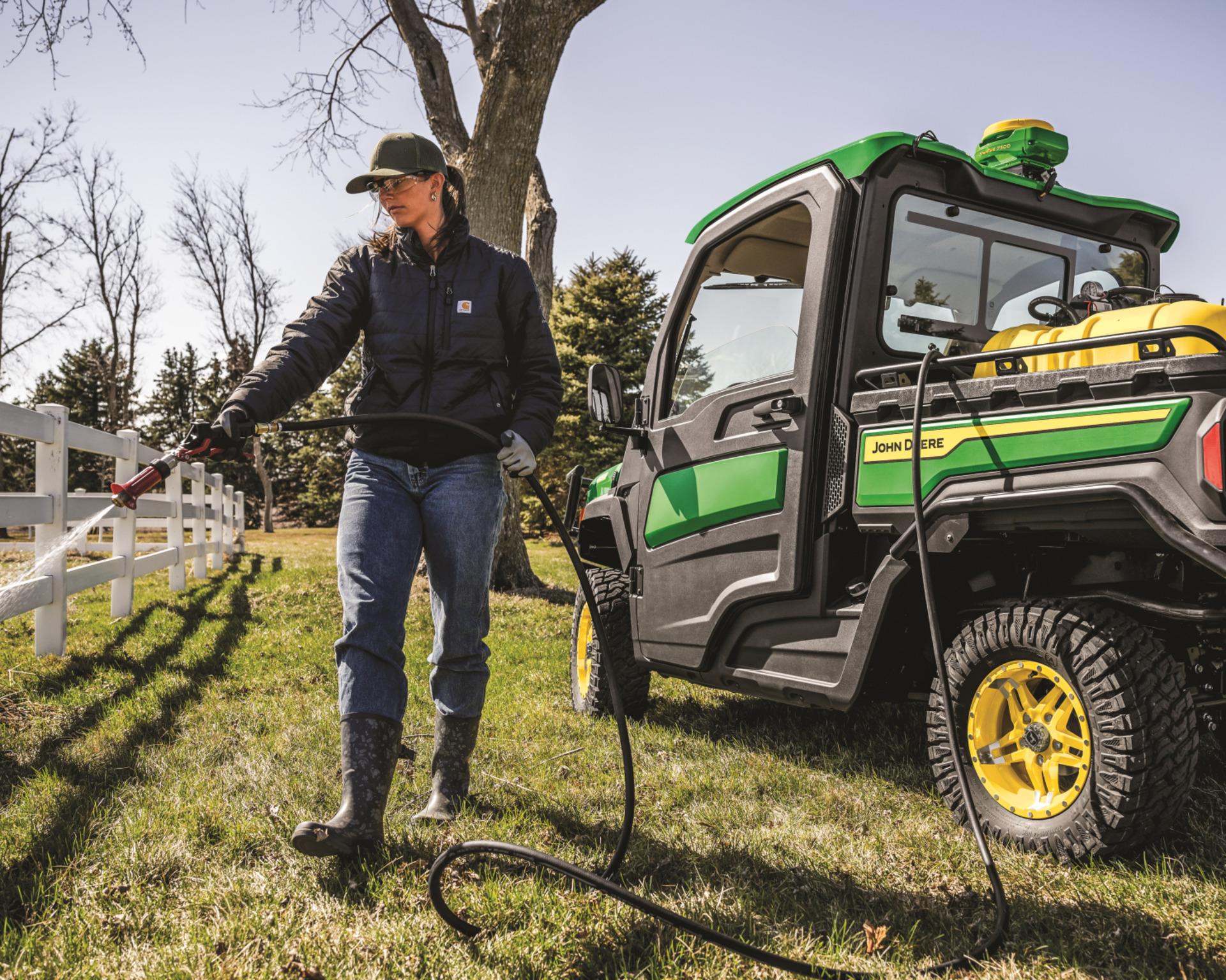 John Deere Gator XUV 845R with a sprayer tank attachment.