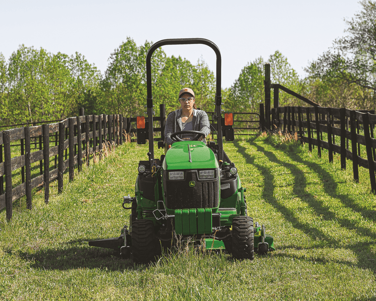 A John Deere 1025 mows a lawn in California.